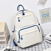Backpack by Simples Market, white with blue zippers and trim, large-capacity casual student laptop backpack.