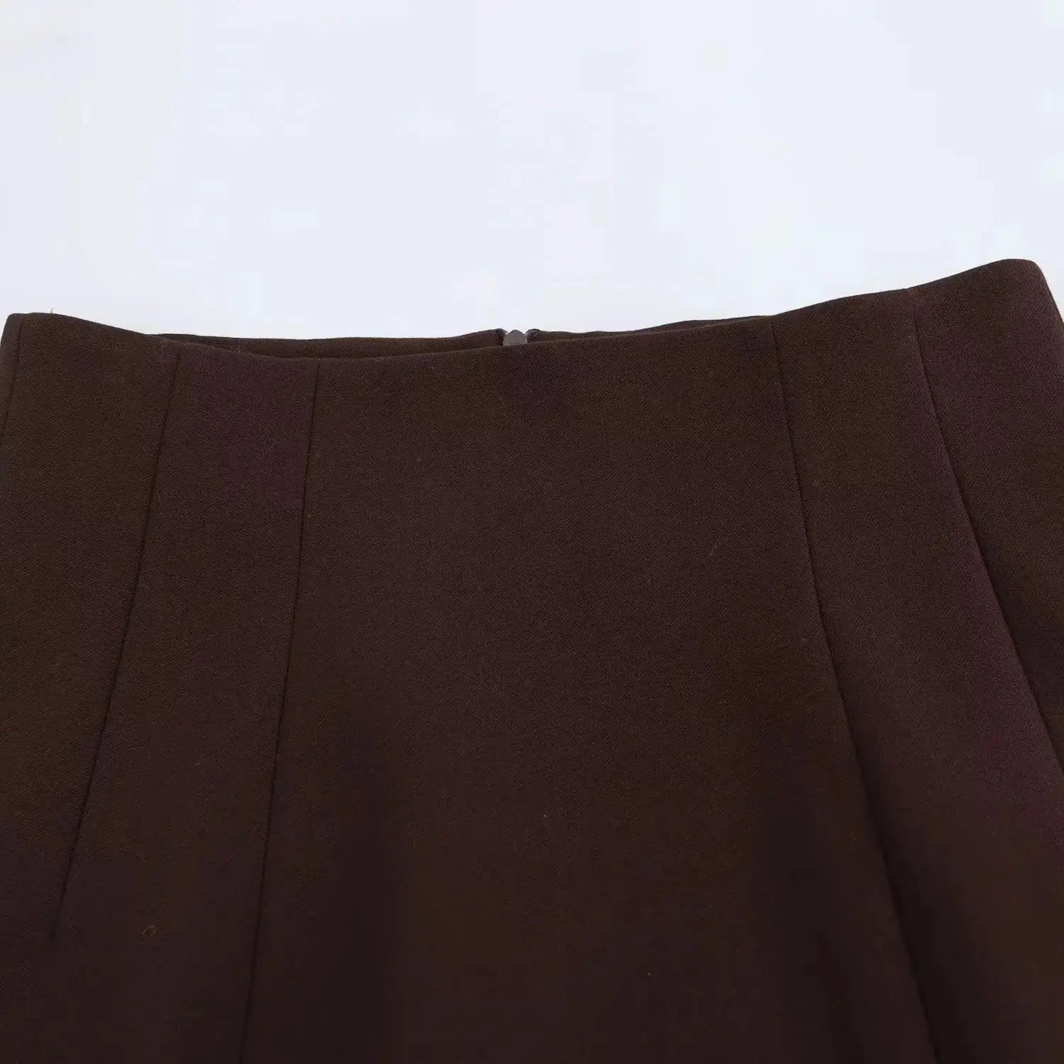 KONDALA brown blazer with vertical seam panels; close-up of front upper garment.