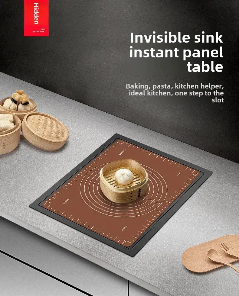 Invisible sink instant panel table on grey countertop; brown induction panel with bamboo steamer and wooden utensils.