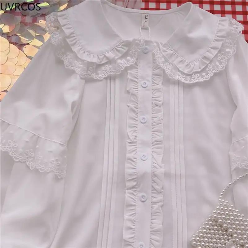 White Lolita blouse by Simples Market with lace Peter Pan collar, ruffled front, and long sleeves