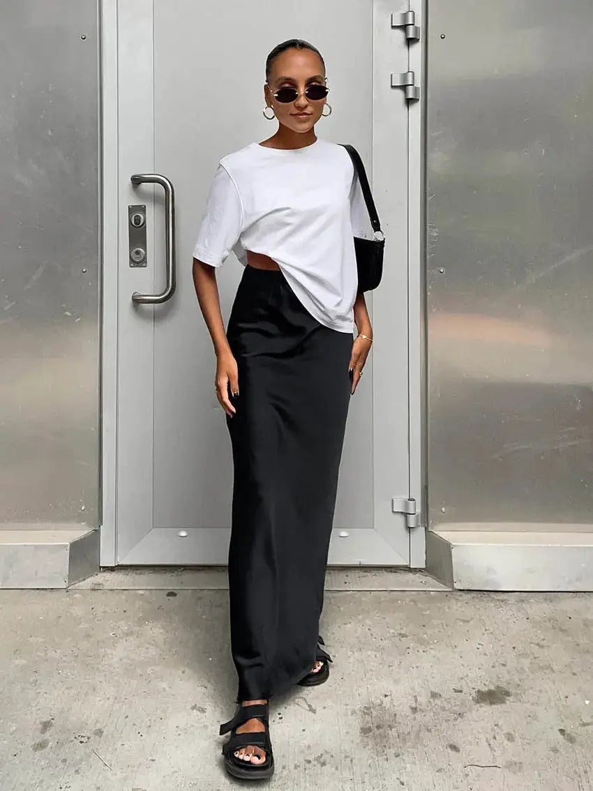 Satin black trumpet skirt, high-waisted and long, solid office-ready design
