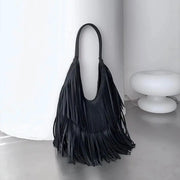 Long fringe tassel hobo handbag by Simples Market in black PU leather with a long shoulder strap