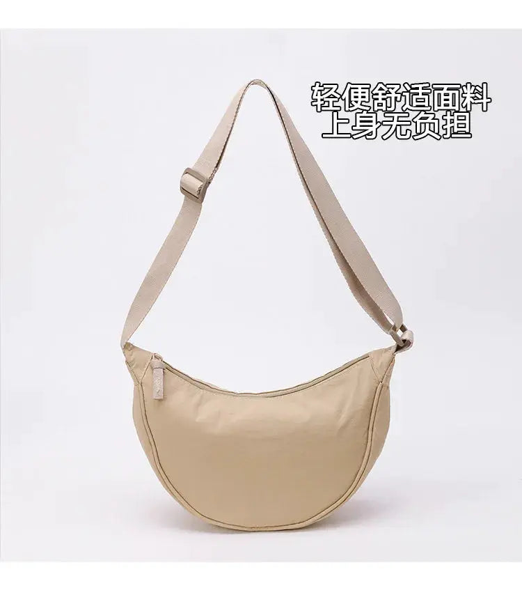 Beige nylon zipper crossbody bag with crescent shape, large capacity and adjustable strap for men and women