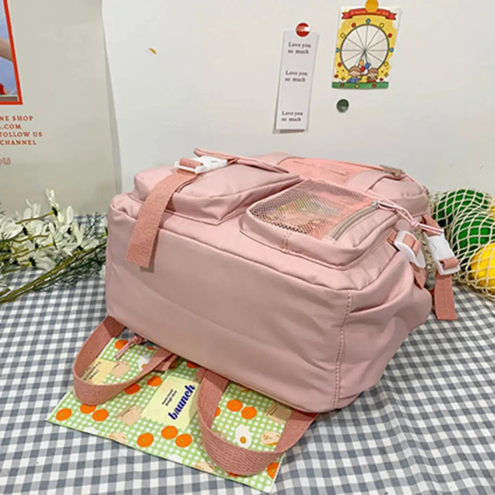 Simples Market pink school backpack, lightweight large-capacity rucksack with multiple pockets and pink straps.