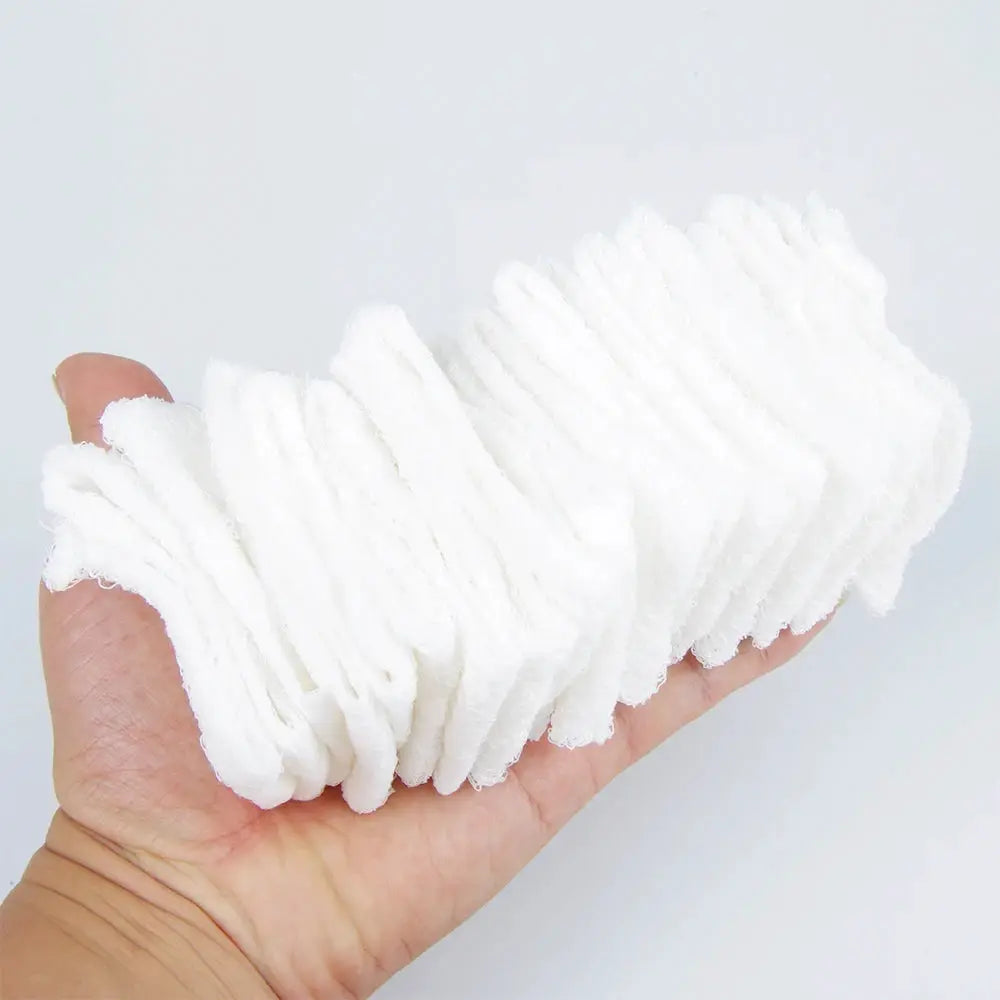 First aid compressed sterile gauze strips, white, held in hand, Z-folded emergency medical dressing