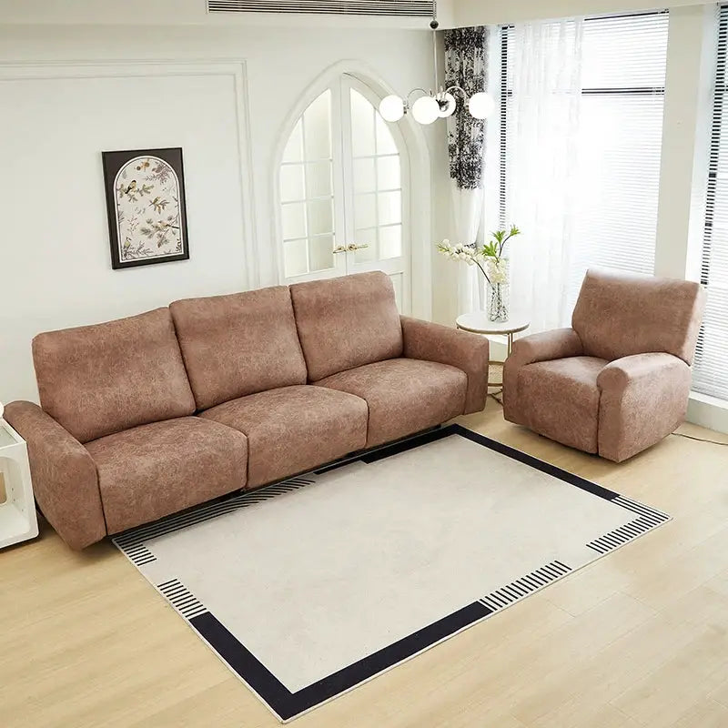 Simples Market waterproof PU sofa covers on a brown 3-seat sofa and matching armchair in a bright living room