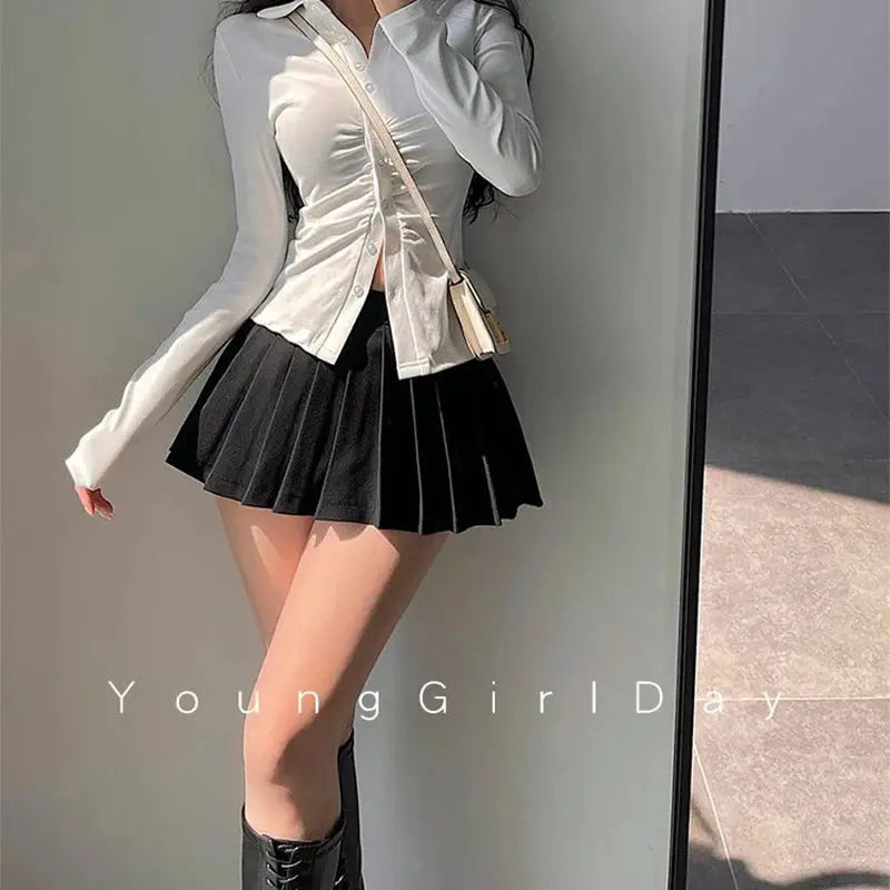 Pleated mini skirt with shorts, black high-waist A-line