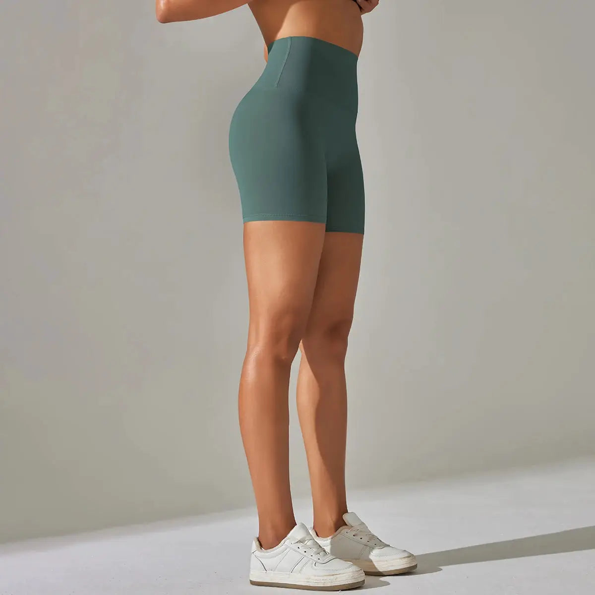 Women's teal high-waist athletic shorts for yoga and workouts, quick-dry fabric