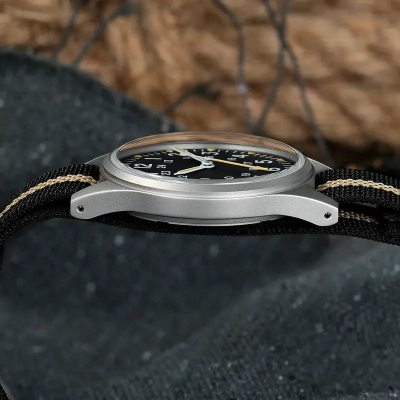 Militado ML07 quartz military watch with black dial, silver case, and striped fabric strap
