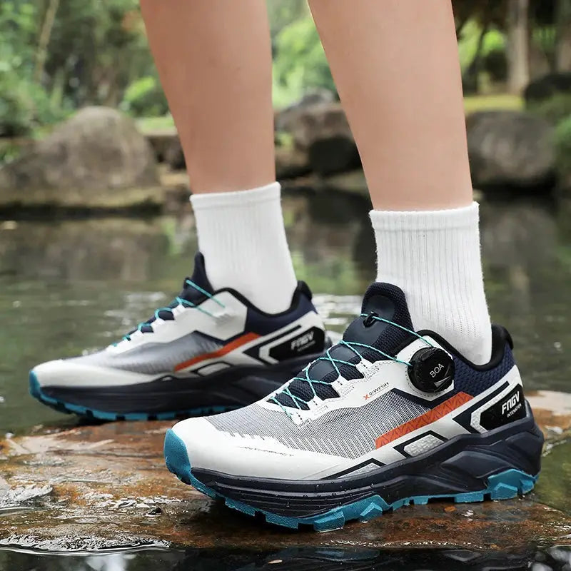Pair of men's breathable casual sneakers with white and gray uppers, orange accents and teal outsoles.