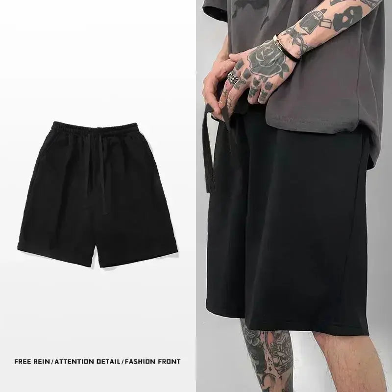 Shorts, black cotton unisex knee-length, breathable beachwear; two pairs shown