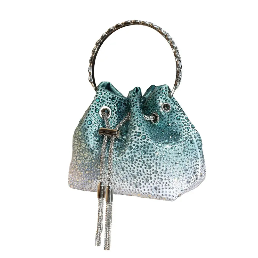 Evening rhinestone clutch in teal gradient with crystal-studded handle and tassel pulls