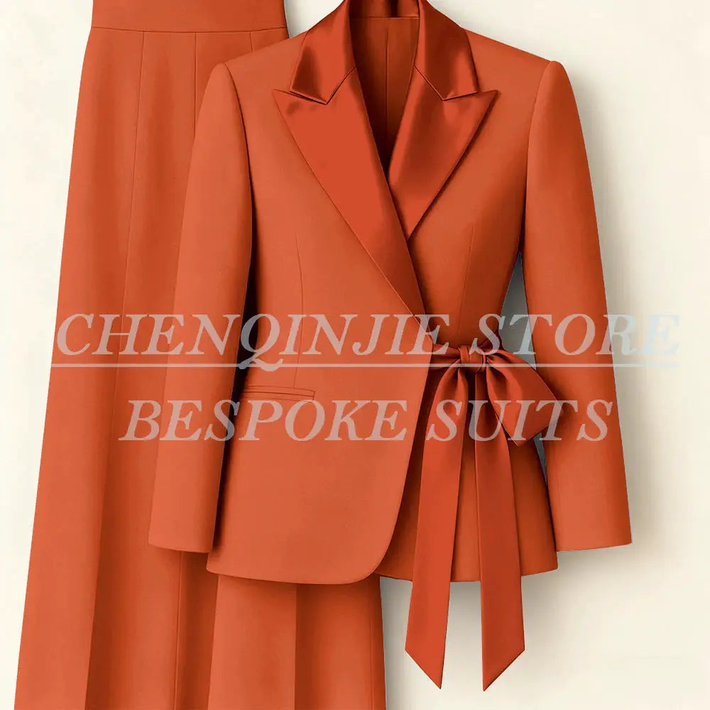 Women's orange blazer suit set with peak lapels and waist-tie belt, 2-piece jacket and pants by Simples Market