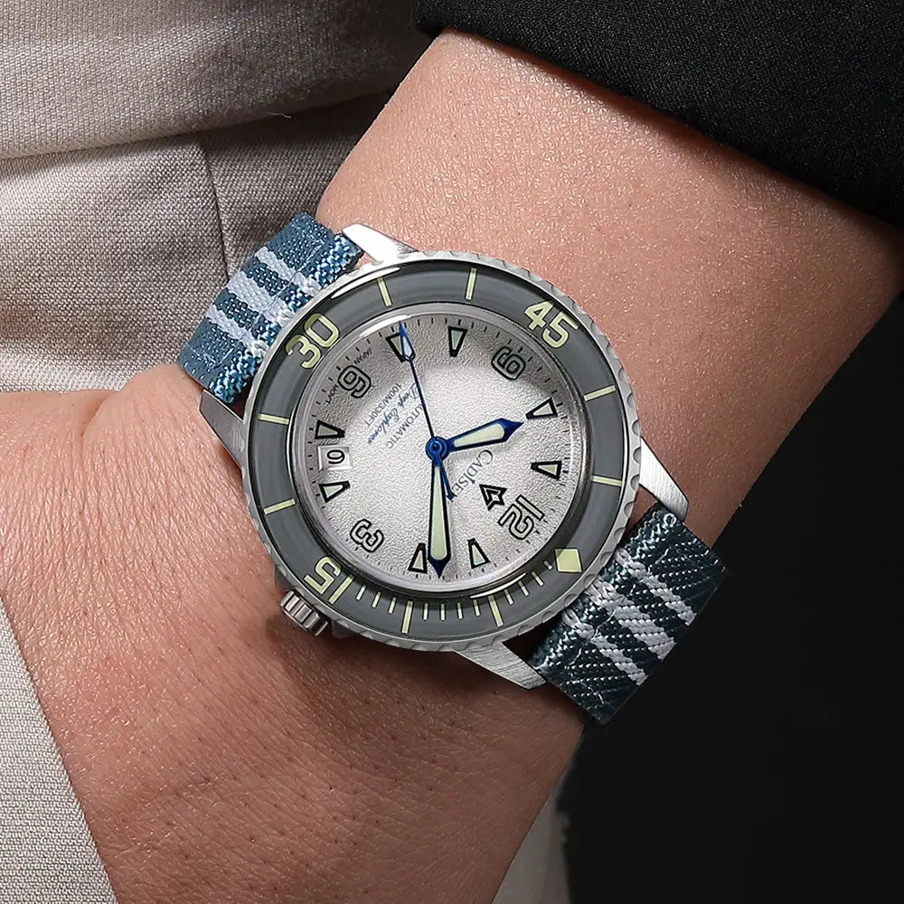 CADISEN Deep Explorer automatic mechanical watch with blue plaid canvas strap and silver dial.