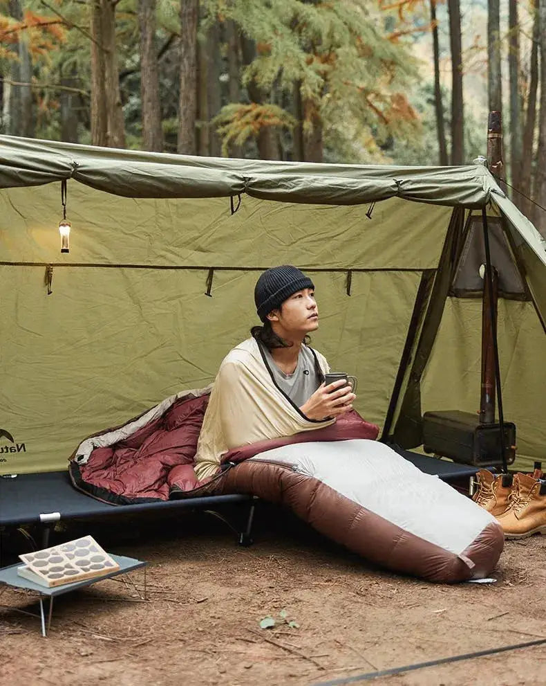 Naturehike mummy sleeping bag liner, ultralight white with brown ends, used in a tent