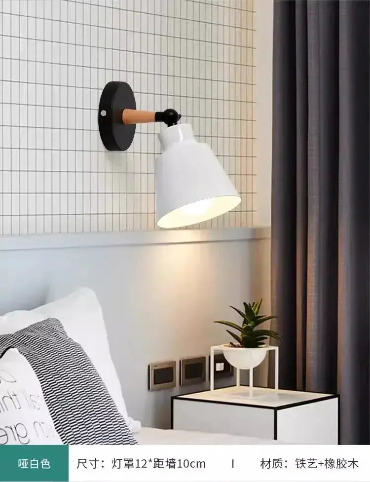 Nordic solid wood LED wall lamp with white conical shade and wooden arm, wall-mounted in a modern bedroom.