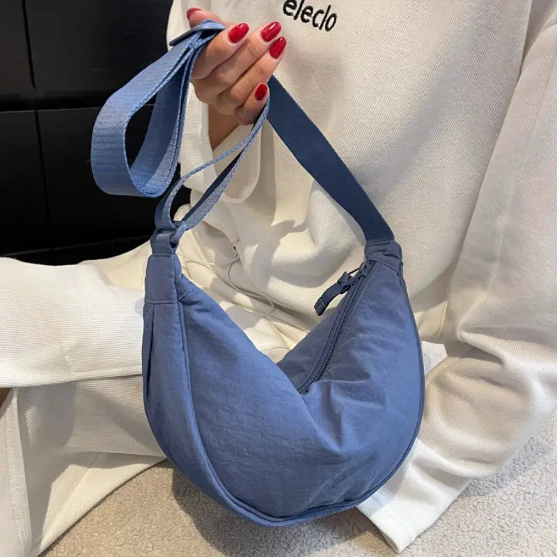 Nylon hobo crossbody bag in blue with zipper closure for women