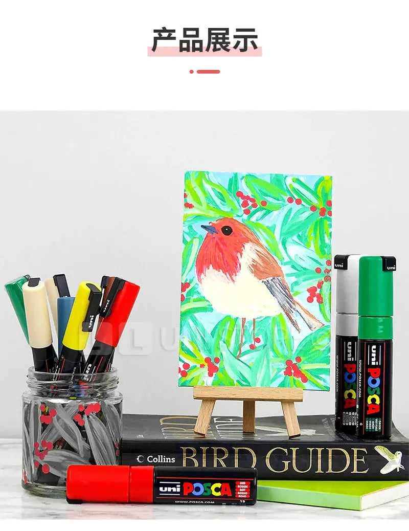 Uni Posca paint marker pens full set PC-1M PC-3M PC-5M with vinyl case, shown beside a bird painting on canvas.