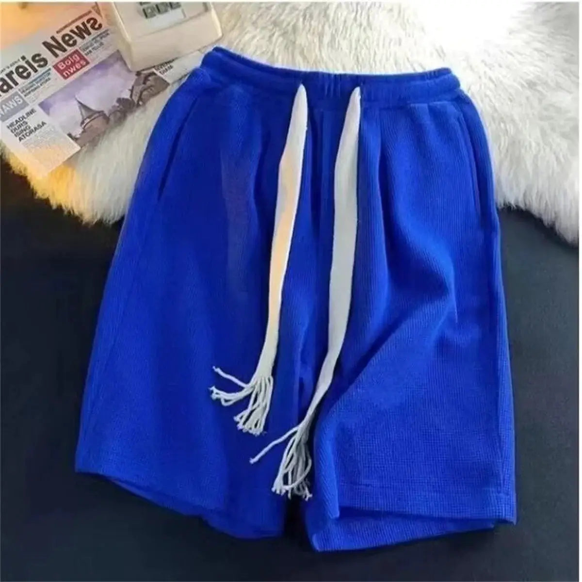 Men's blue breathable shorts with white drawstrings, lightweight athletic basketball-style shorts