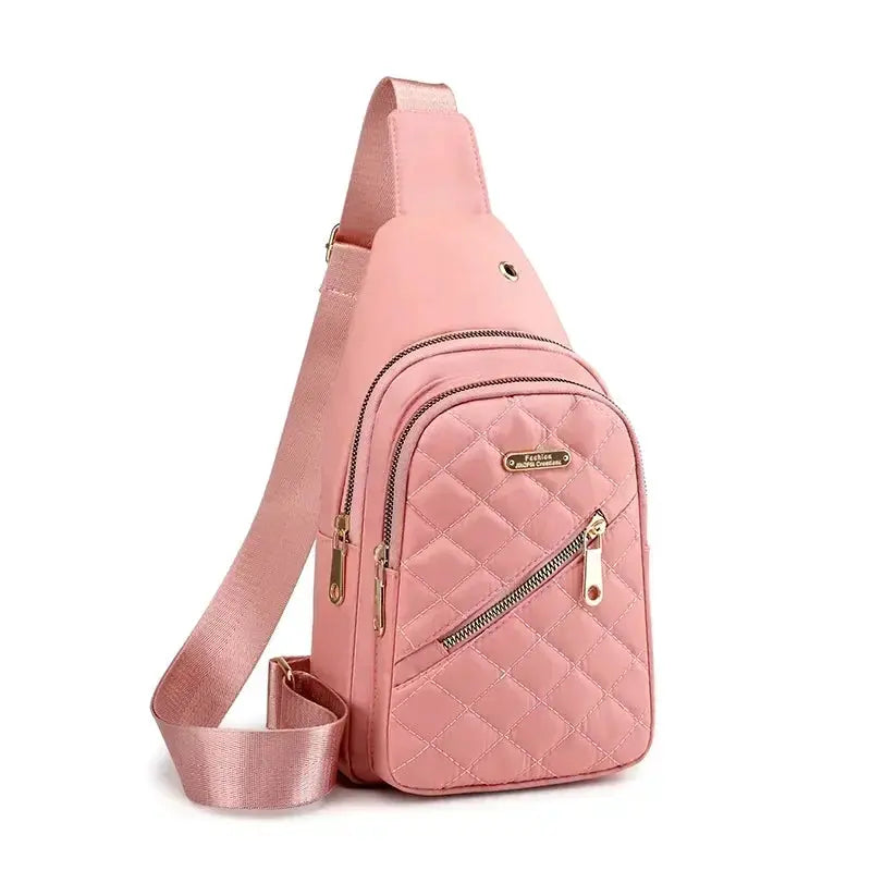 Pink quilted crossbody shoulder bag by Simples Market with gold-tone zippers