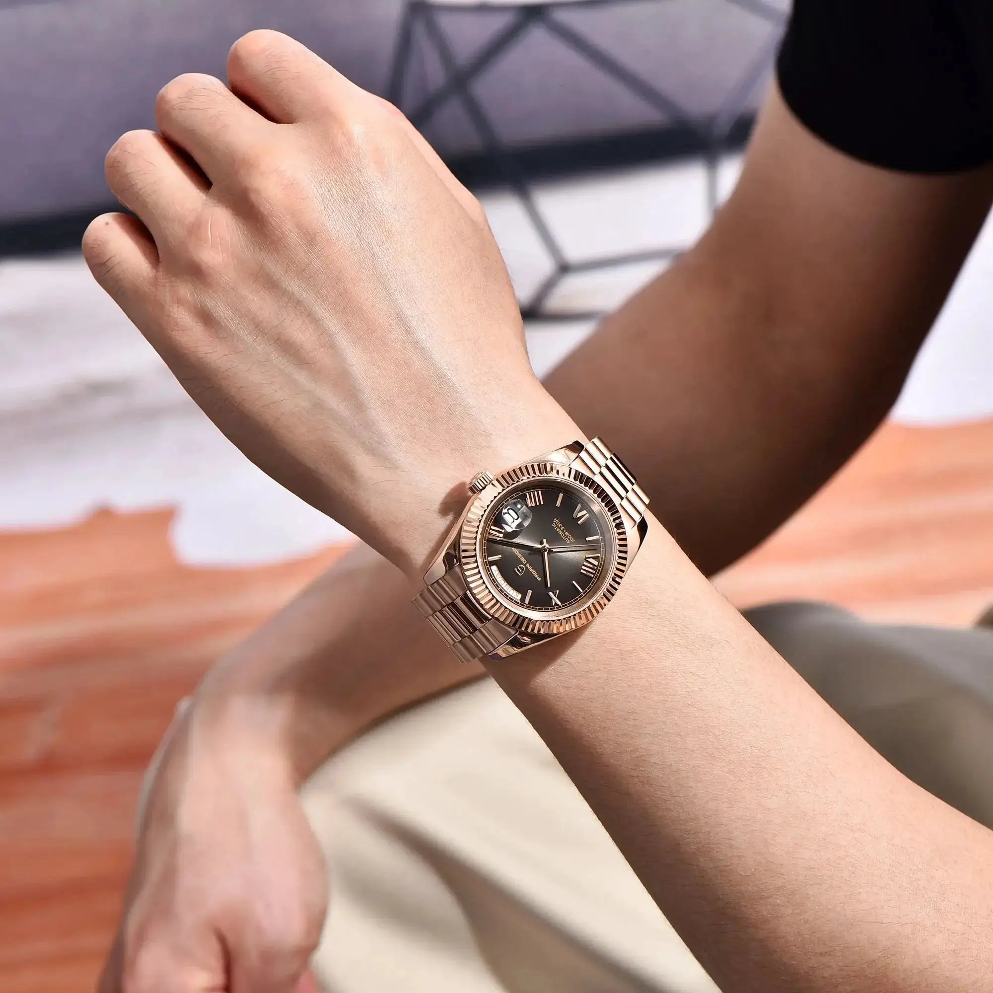 Rose-gold Pagani Design men's automatic wristwatch with stainless steel bracelet on wrist
