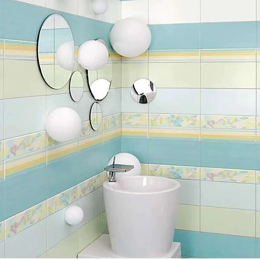 LED glass ball wall lights in white, minimalist bathroom with round mirror and blue-tiled walls