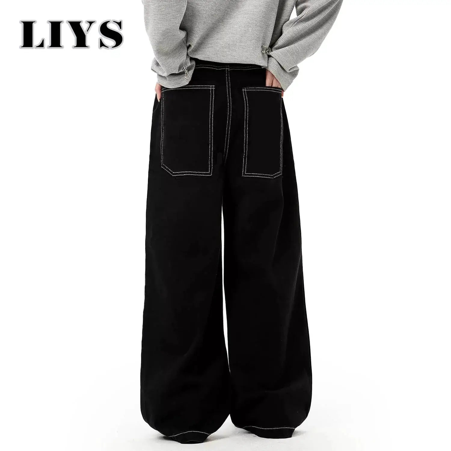 Baggy black denim jeans by LIYS, with white-stitched back pockets and wide-leg silhouette