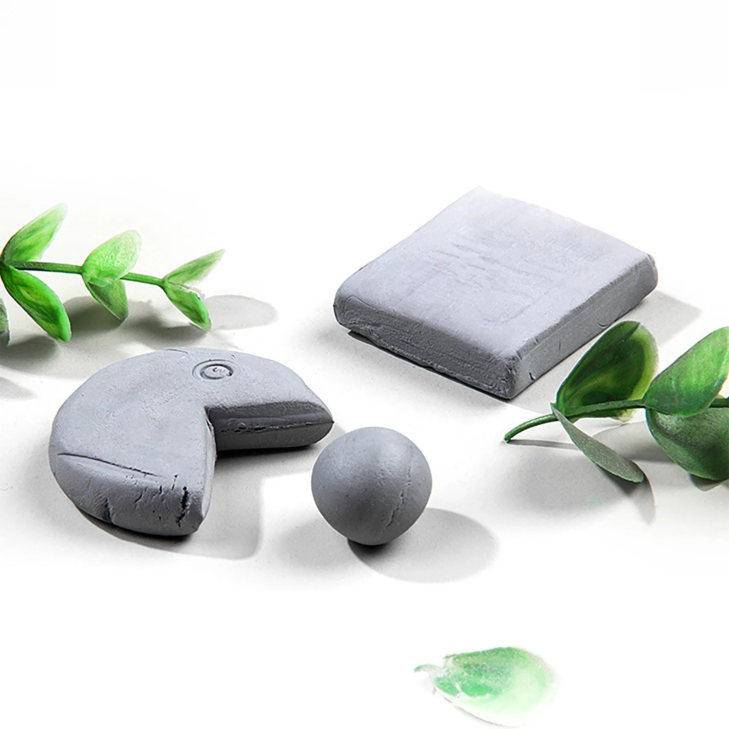 Grey kneaded erasers set by Simples Market for shading and blending; assorted shapes.