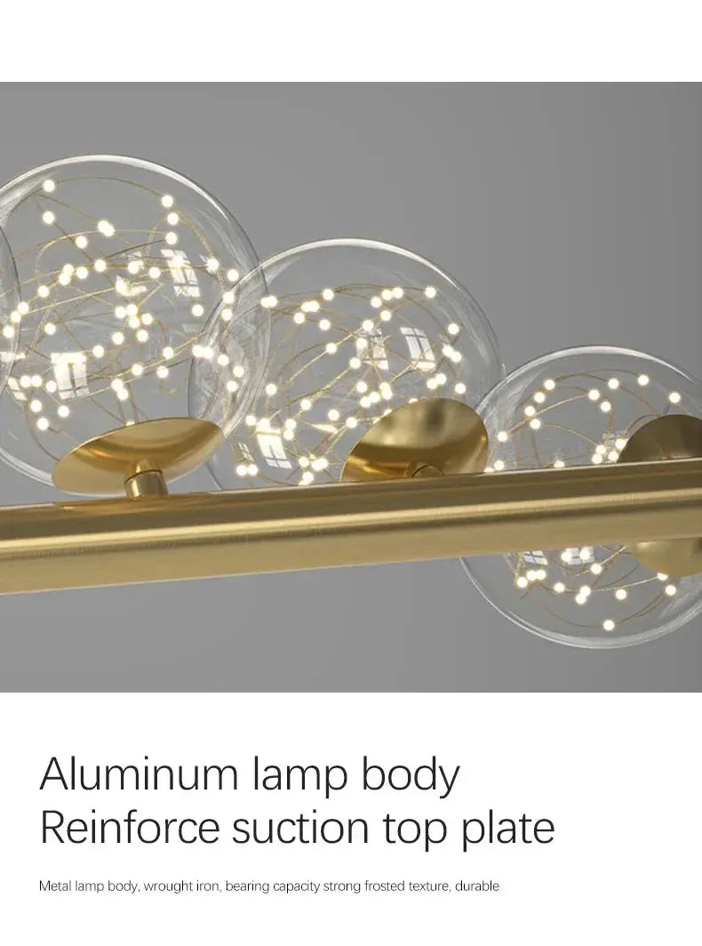 Nordic ceiling chandelier with gold-tone bar and clear glass globe bulbs for modern living room lighting