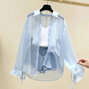 Chiffon blouse by Simples Market Smvp, light blue sheer long-sleeve button-up with bow-tied cuffs.