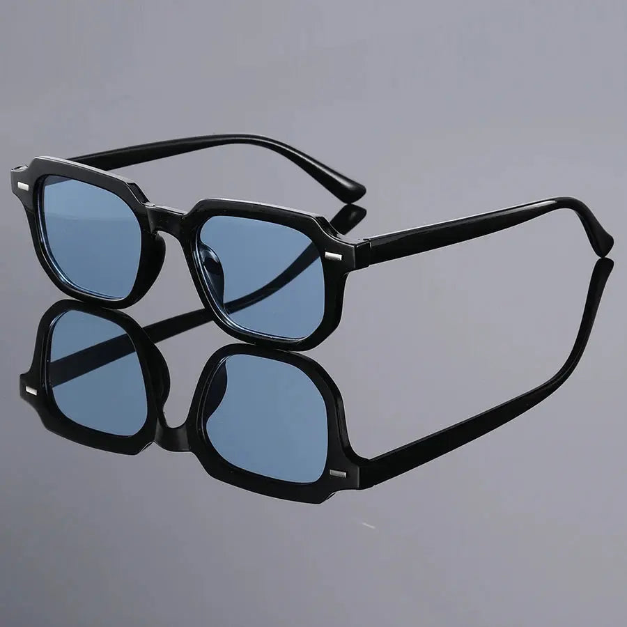 Men's fashion glasses with square black frame and blue lenses, rivet accents.