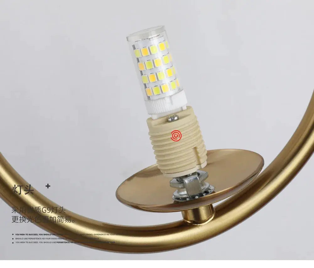 LED wall lamp with a glass ball LED module, gold metal curved frame, Nordic minimalist design