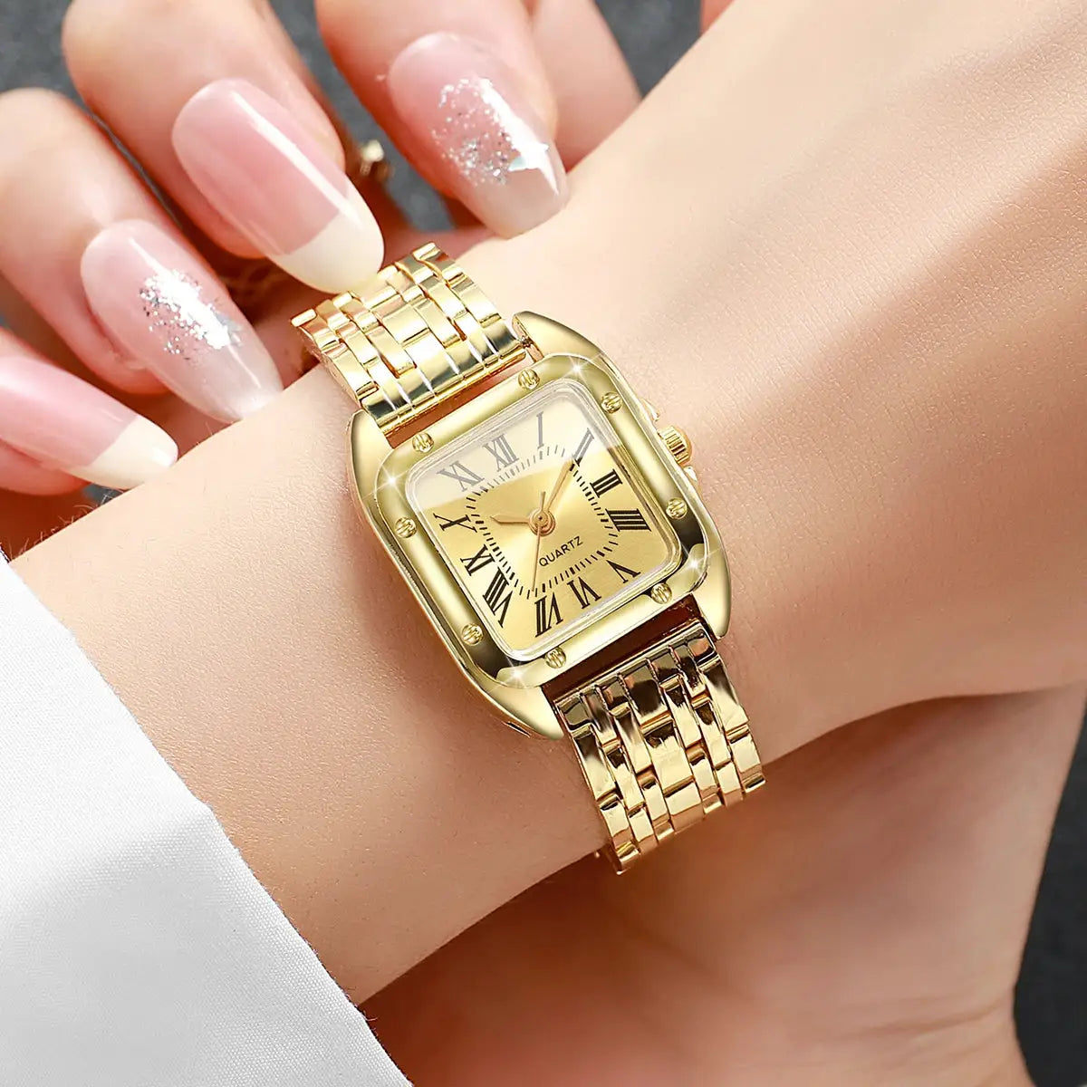 Gold-tone square women's quartz watch with Roman numeral dial and linked bracelet