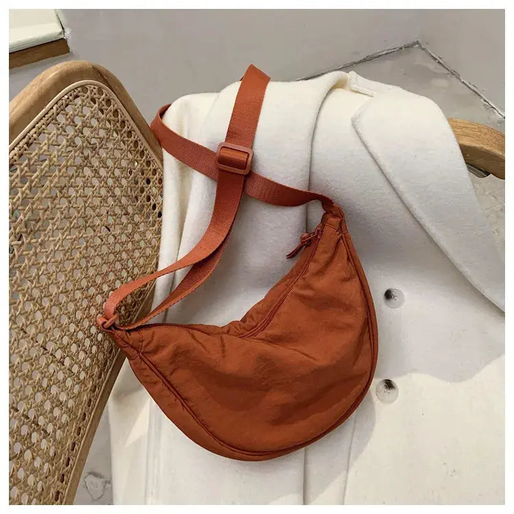 Casual nylon hobo crossbody bag by Simples Market in rust brown with adjustable strap
