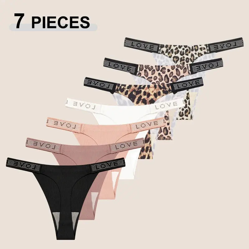 7-piece thong set for women by Simples Market; leopard print and solid colors, low-rise, crystal-embellished waistbands.