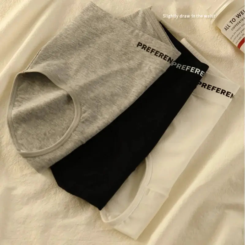 Three-pack cotton women's high-waist panties in gray, black, and white