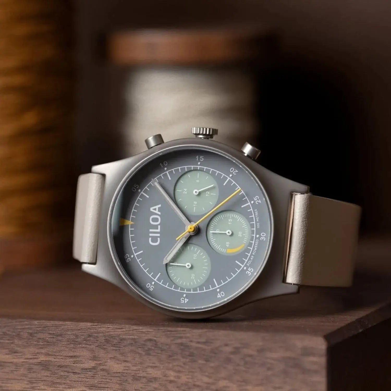 CILOA round gray men's watch with yellow hands and green subdials