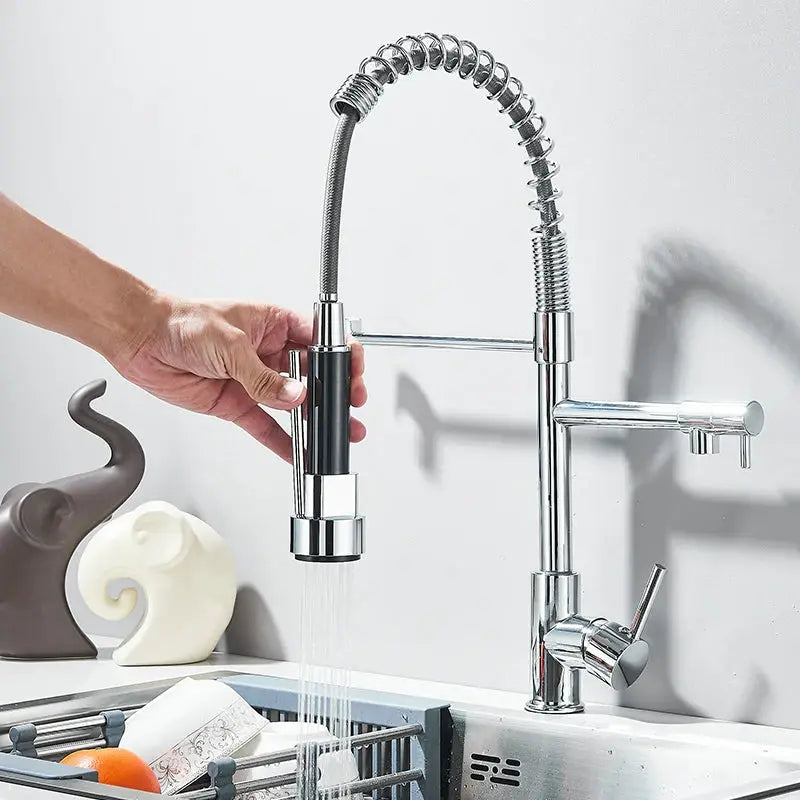 Chrome pull-down kitchen faucet with flexible coiled hose, dual swivel spout, hot and cold water mixer, deck-mounted