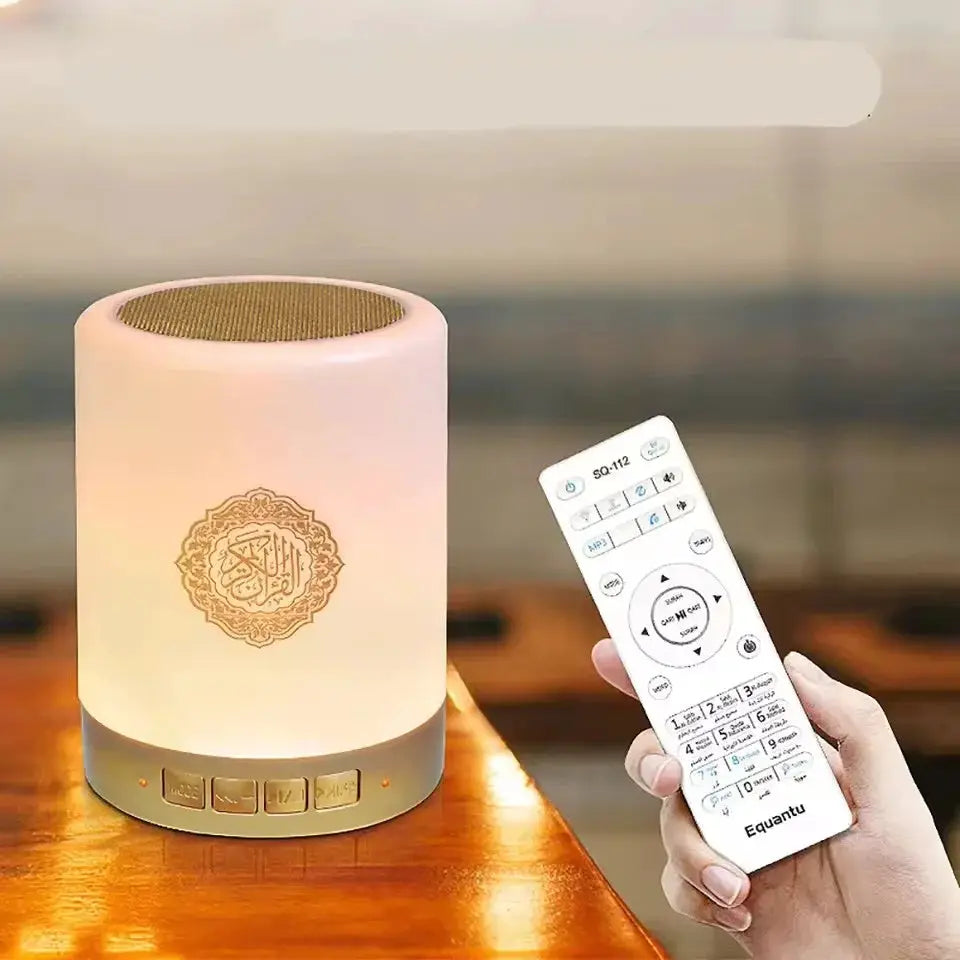 Portable white lamp with gold base, multifunctional sound machine with LED night light and APP remote control.