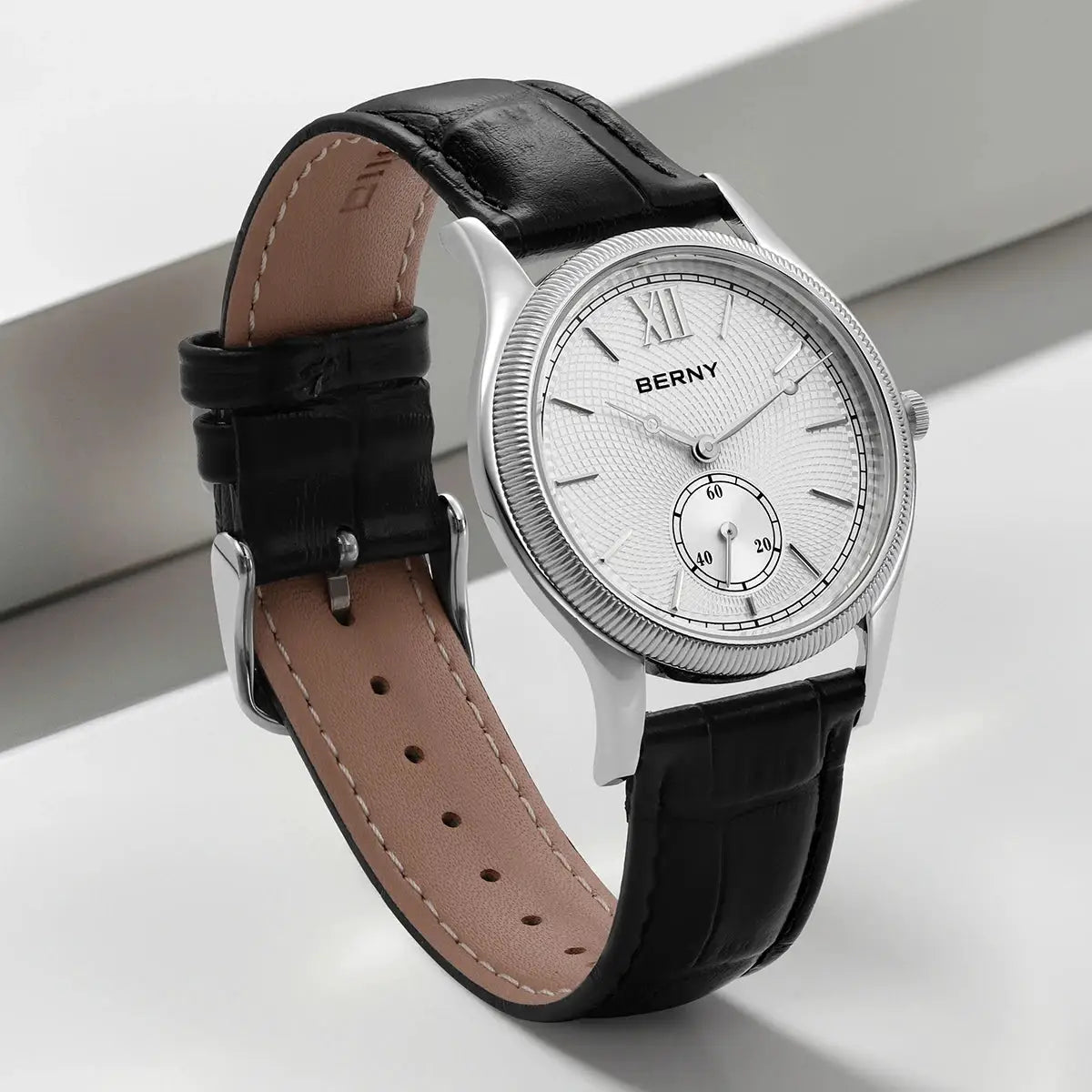 BERNY men's dress watch with black leather strap, silver case, and textured white dial.