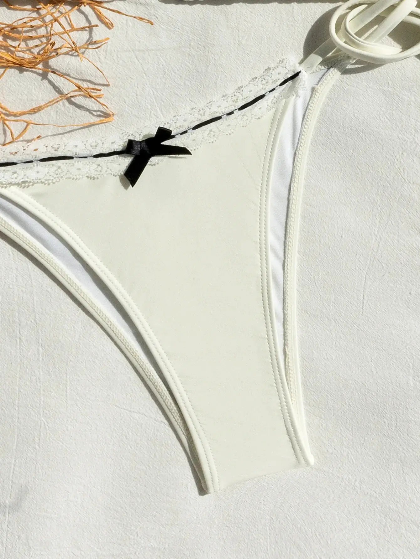 Simples Market white triangle bikini top with lace trim and black bow