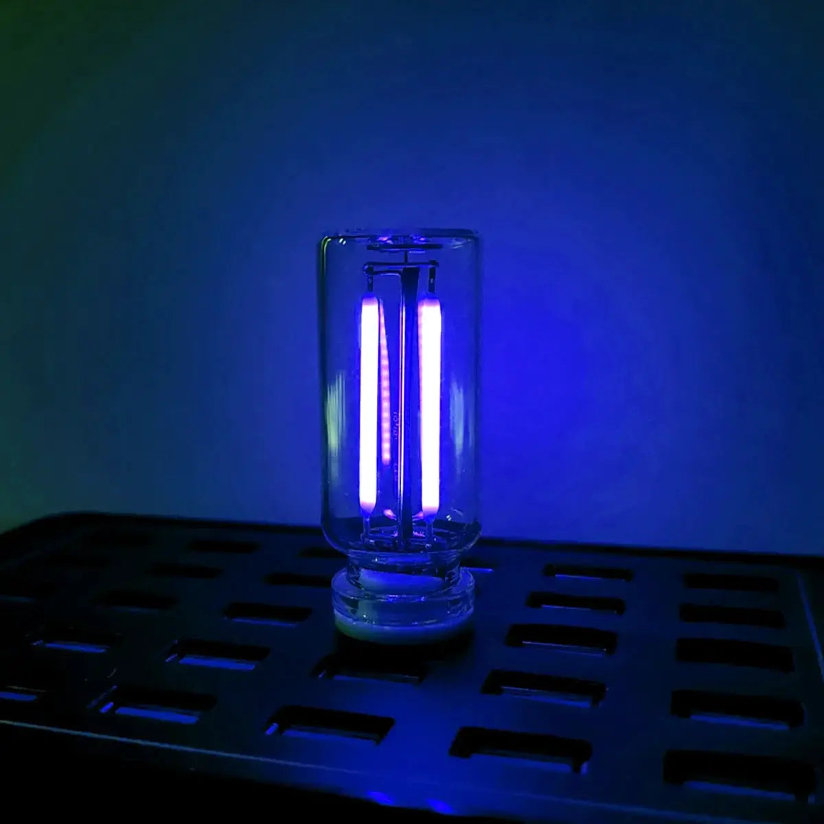 Portable USB touch night light with glass filament lamp glowing blue