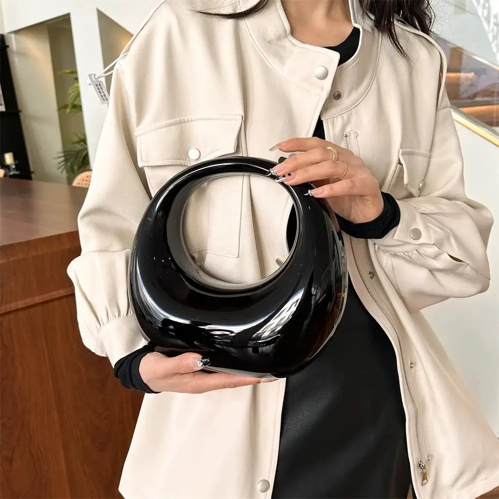 MOODS Golden Evening Handbag black glossy PVC round-handle clutch