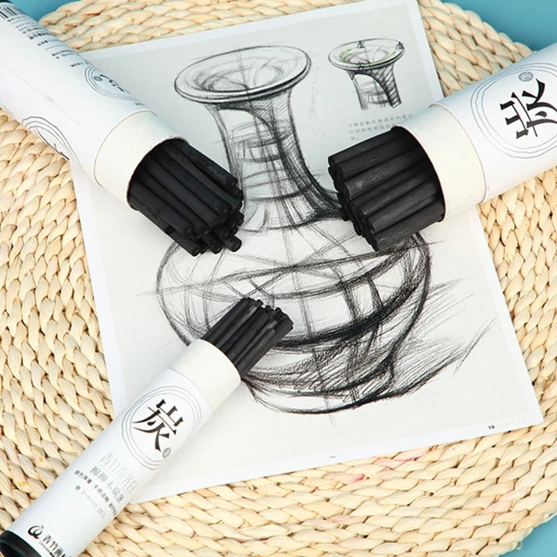 25pcs art charcoal sticks; three black bundles on a vase drawing, displayed with white labeled wrappers