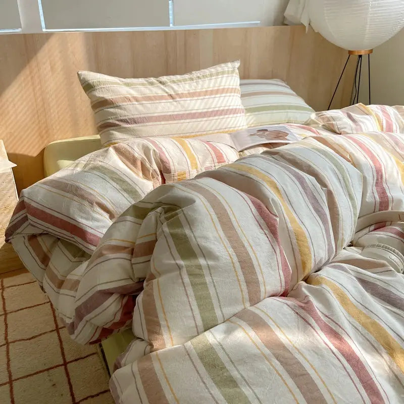 Duvet cover set with matching pillowcases in pastel-striped 100% cotton; pink, green, yellow and beige