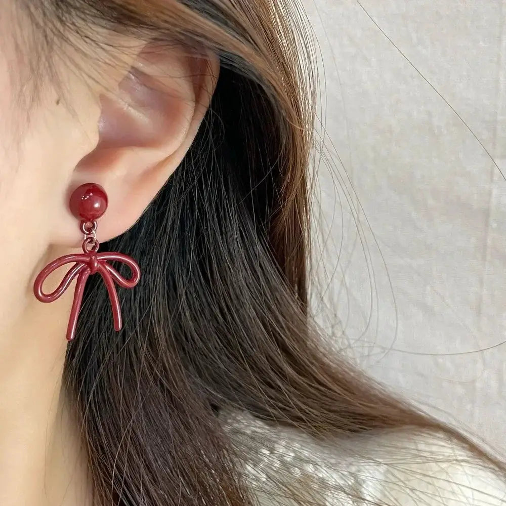 Bowknot stud earrings in red with round bead and bow charm for women