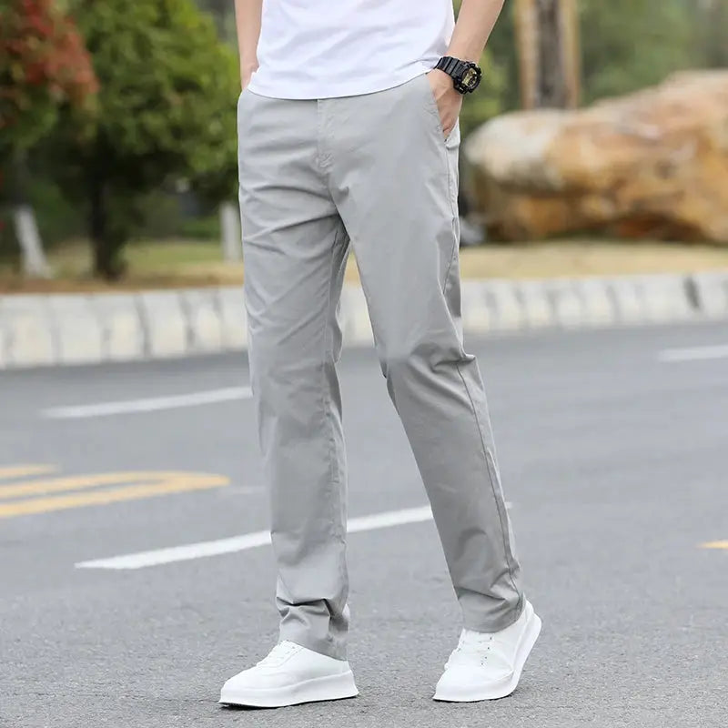 Men's light gray cotton chinos with breathable straight-leg fit; sizes w28–w40.