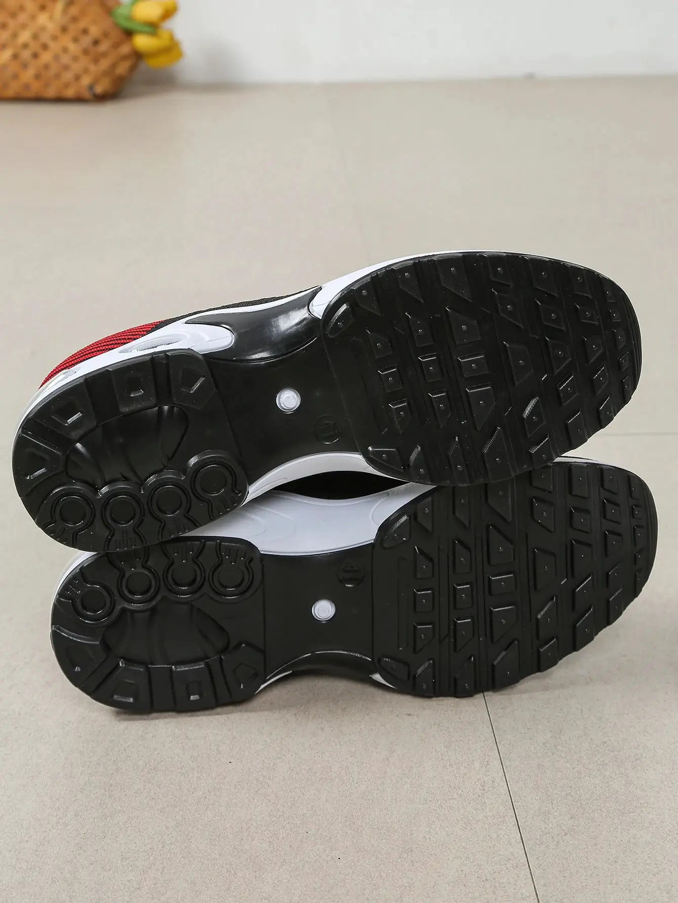 Two men's running shoes by Simples Market; black outsole, white midsole, red upper.