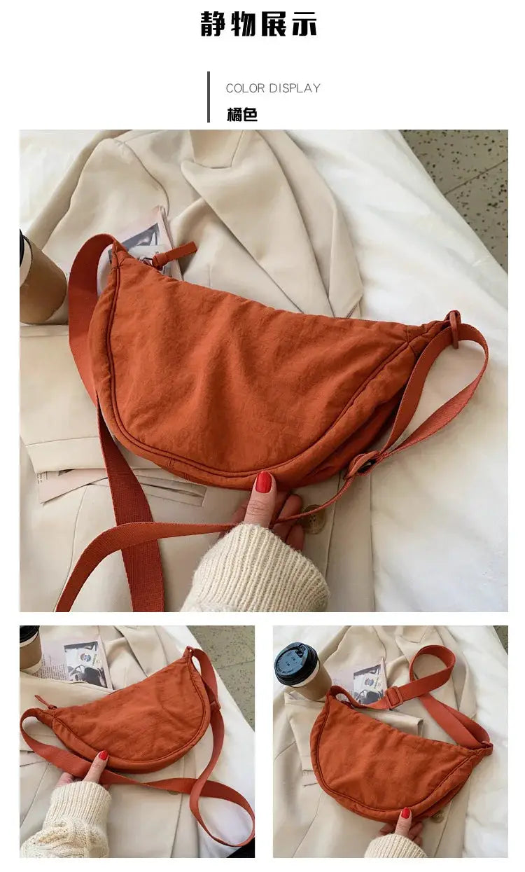 Casual nylon hobo crossbody bag in burnt orange with adjustable strap.