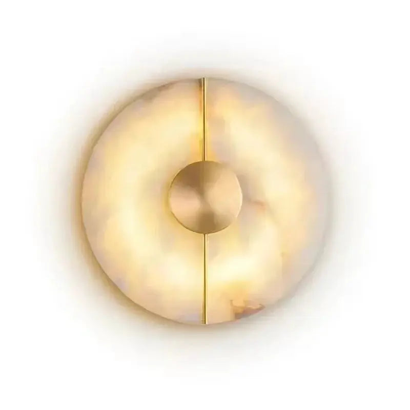 Alabaster marble wall sconce by Simples Market with gold vertical line and circular center knob.